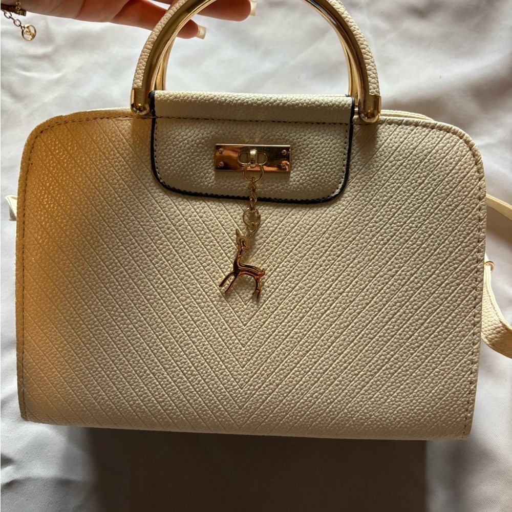 Elegant Cream Handbag with Gold Accents